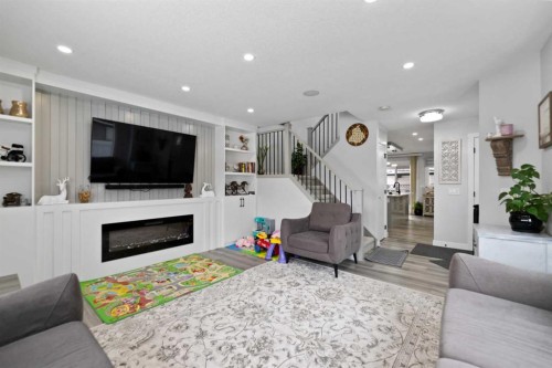 313 Falwood Way Ne, Calgary, AB - Indoor Photo Showing Living Room With Fireplace