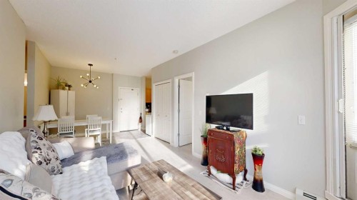 107-8 Prestwick Pond Terrace Se, Calgary, AB - Indoor Photo Showing Living Room