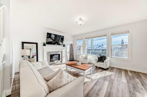 18 Mount Rae Place, Okotoks, AB - Indoor Photo Showing Living Room With Fireplace