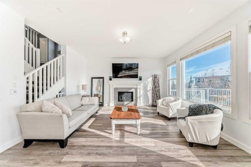 18 Mount Rae Place, Okotoks, AB - Indoor Photo Showing Living Room With Fireplace
