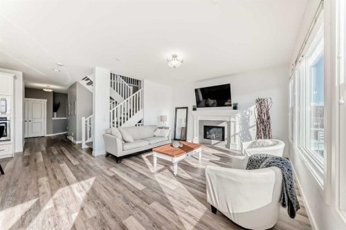 18 Mount Rae Place, Okotoks, AB - Indoor Photo Showing Living Room With Fireplace
