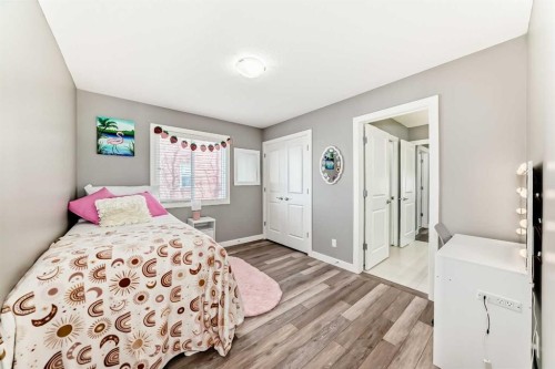 18 Mount Rae Place, Okotoks, AB - Indoor Photo Showing Bedroom