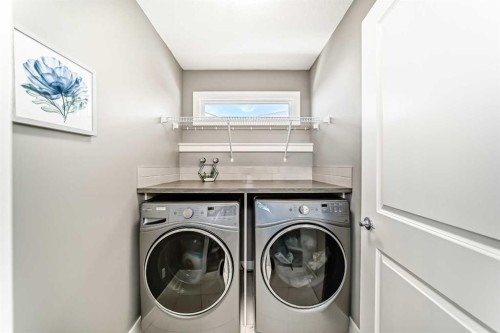 18 Mount Rae Place, Okotoks, AB - Indoor Photo Showing Laundry Room