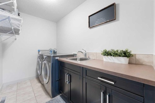 35 Aspenshire Drive Sw, Calgary, AB - Indoor Photo Showing Laundry Room