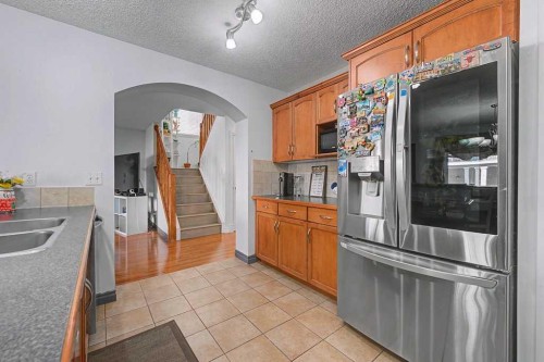 284 Hawkmere View, Chestermere, AB - Indoor Photo Showing Kitchen With Double Sink