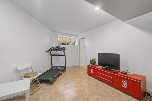 284 Hawkmere View, Chestermere, AB - Indoor Photo Showing Gym Room