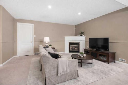 138 Sierra Morena Green Sw, Calgary, AB - Indoor Photo Showing Living Room With Fireplace