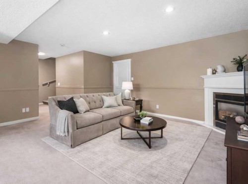 138 Sierra Morena Green Sw, Calgary, AB - Indoor Photo Showing Living Room With Fireplace