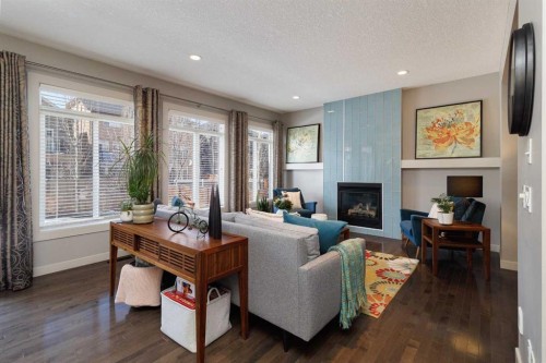 344 Evergreen Circle Sw, Calgary, AB - Indoor Photo Showing Living Room With Fireplace