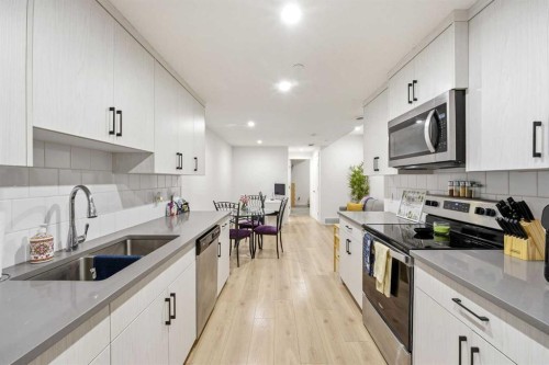 29 Herron Mews Ne, Calgary, AB - Indoor Photo Showing Kitchen With Double Sink With Upgraded Kitchen