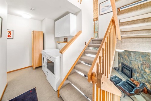 8-838 3Rd Street, Canmore, AB - Indoor Photo Showing Other Room With Fireplace