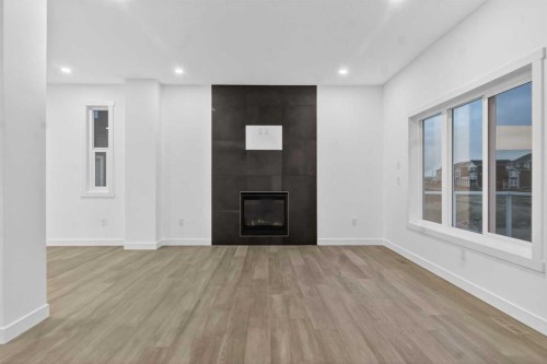 267 Chelsea Heath, Chestermere, AB - Indoor Photo Showing Other Room With Fireplace