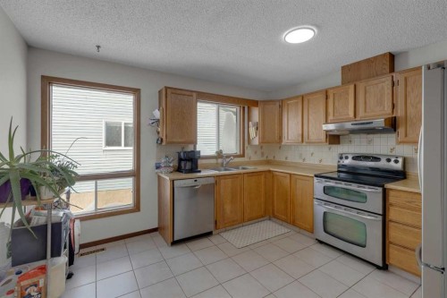92 Macewan Drive Nw, Calgary, AB - Indoor Photo Showing Kitchen With Double Sink
