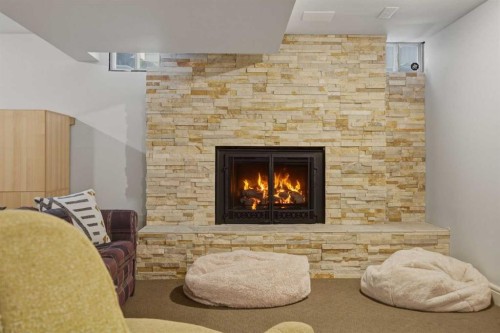 1136 Kildonan Place Sw, Calgary, AB - Indoor Photo Showing Other Room With Fireplace