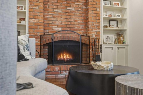 1136 Kildonan Place Sw, Calgary, AB - Indoor Photo Showing Living Room With Fireplace