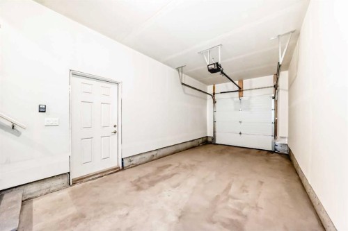 203-225 Redstone Walk Ne, Calgary, AB - Indoor Photo Showing Garage