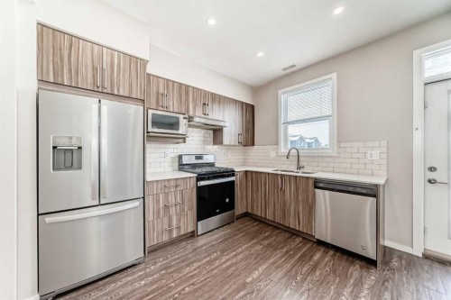 203-225 Redstone Walk Ne, Calgary, AB - Indoor Photo Showing Kitchen With Upgraded Kitchen