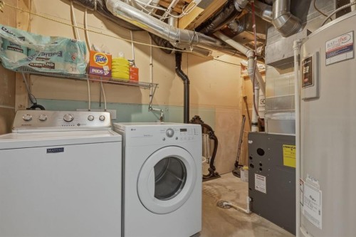 68 Auburn Bay Crescent Se, Calgary, AB - Indoor Photo Showing Laundry Room