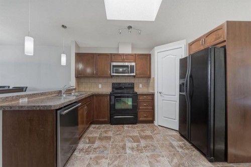 68 Auburn Bay Crescent Se, Calgary, AB - Indoor Photo Showing Kitchen With Double Sink