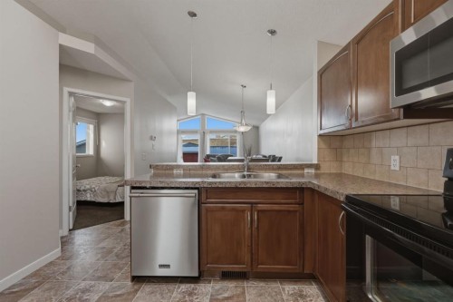 68 Auburn Bay Crescent Se, Calgary, AB - Indoor Photo Showing Kitchen With Double Sink