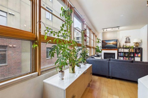 109-177 9 Street Ne, Calgary, AB - Indoor With Fireplace