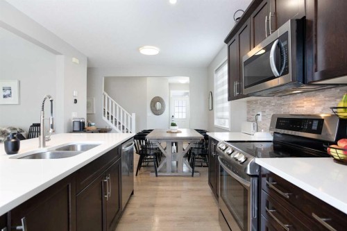 2 Osborne Common Sw, Airdrie, AB - Indoor Photo Showing Kitchen With Double Sink