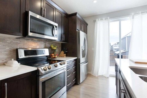 2 Osborne Common Sw, Airdrie, AB - Indoor Photo Showing Kitchen With Upgraded Kitchen