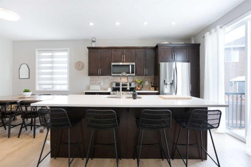 2 Osborne Common Sw, Airdrie, AB - Indoor Photo Showing Kitchen With Upgraded Kitchen