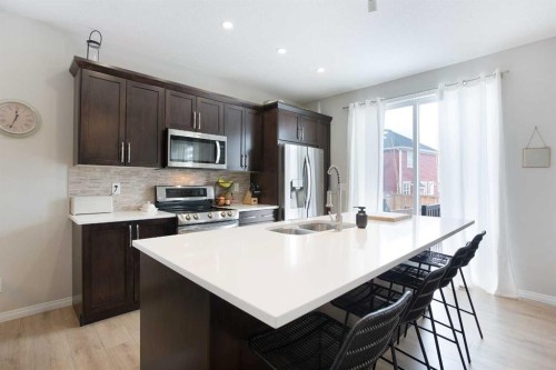 2 Osborne Common Sw, Airdrie, AB - Indoor Photo Showing Kitchen With Double Sink