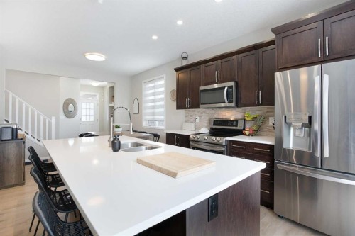 2 Osborne Common Sw, Airdrie, AB - Indoor Photo Showing Kitchen With Double Sink With Upgraded Kitchen