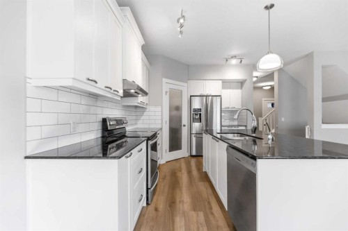 625 Midtown Place, Airdrie, AB - Indoor Photo Showing Kitchen With Stainless Steel Kitchen With Upgraded Kitchen
