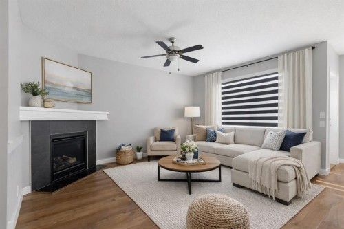 625 Midtown Place, Airdrie, AB - Indoor Photo Showing Living Room With Fireplace