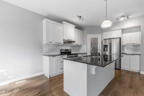 625 Midtown Place, Airdrie, AB - Indoor Photo Showing Kitchen With Stainless Steel Kitchen With Upgraded Kitchen