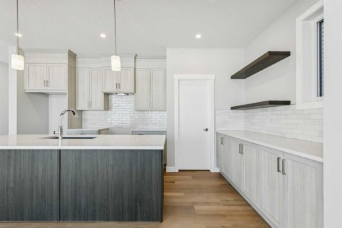 12 Willow Park Point, Cochrane, AB - Indoor Photo Showing Kitchen With Upgraded Kitchen