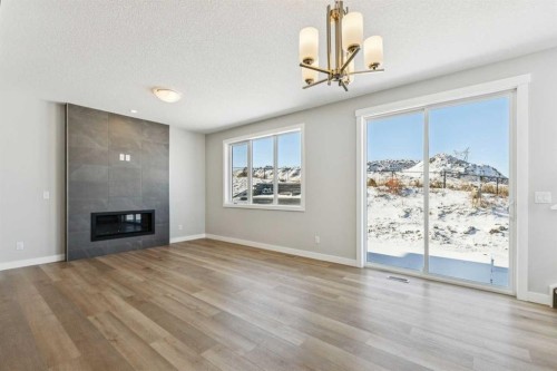 12 Willow Park Point, Cochrane, AB - Indoor Photo Showing Living Room With Fireplace