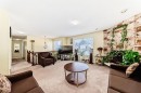 557 Rundleville Place Ne, Calgary, AB  - Indoor Photo Showing Living Room 