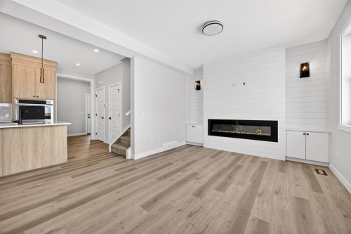 3426 Victory Way, Olds, AB - Indoor With Fireplace