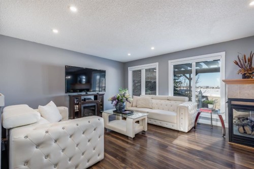 120 Hidden Ranch Crescent Nw, Calgary, AB - Indoor Photo Showing Living Room With Fireplace