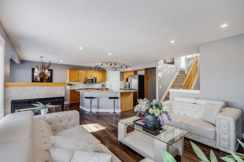 120 Hidden Ranch Crescent Nw, Calgary, AB - Indoor Photo Showing Living Room With Fireplace