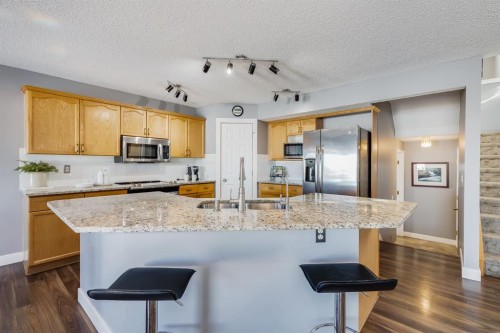 120 Hidden Ranch Crescent Nw, Calgary, AB - Indoor Photo Showing Kitchen With Double Sink With Upgraded Kitchen