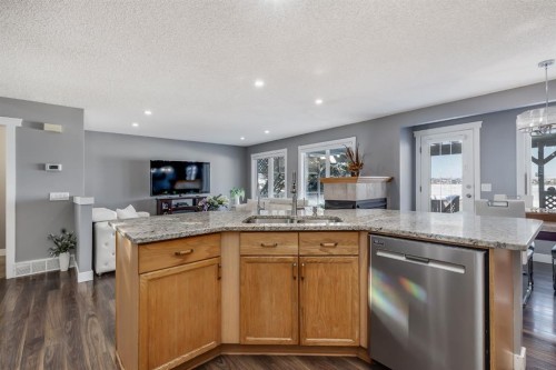 120 Hidden Ranch Crescent Nw, Calgary, AB - Indoor Photo Showing Kitchen With Double Sink