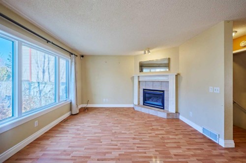 215 Coventry Green Ne, Calgary, AB - Indoor Photo Showing Living Room With Fireplace