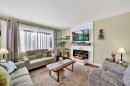 2110 16 Avenue, Didsbury, AB  - Indoor Photo Showing Living Room With Fireplace 