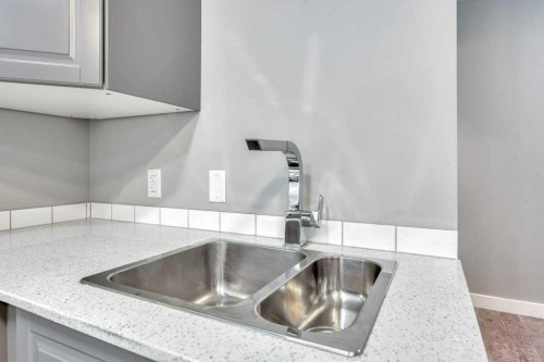 12-606 Lakeside Boulevard, Strathmore, AB - Indoor Photo Showing Kitchen With Double Sink