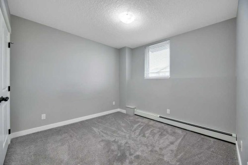 12-606 Lakeside Boulevard, Strathmore, AB - Indoor Photo Showing Other Room