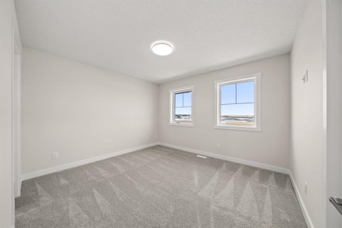 98 Sora Gardens Se, Calgary, AB - Indoor Photo Showing Other Room