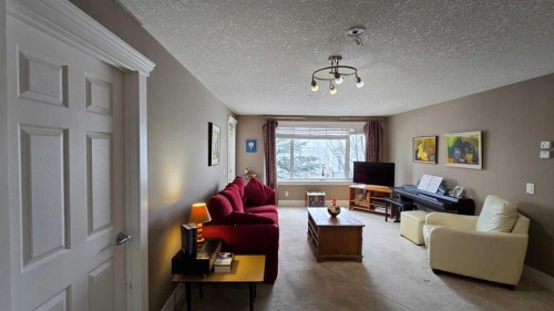 128-500 Rocky Vista Gardens Nw, Calgary, AB - Indoor Photo Showing Living Room