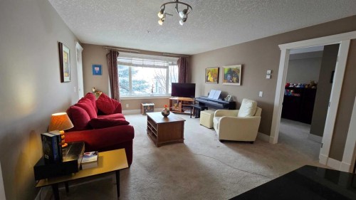 128-500 Rocky Vista Gardens Nw, Calgary, AB - Indoor Photo Showing Living Room
