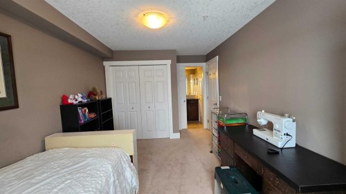 128-500 Rocky Vista Gardens Nw, Calgary, AB - Indoor Photo Showing Bedroom