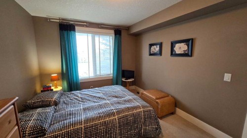 128-500 Rocky Vista Gardens Nw, Calgary, AB - Indoor Photo Showing Bedroom